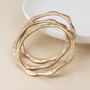 Set Of Three Gold Plated Wave Edge Bangle Bracelet Stack, thumbnail 2 of 5