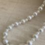 Handcrafted Ivory Pearl Potli With Pearl Wrist Chain, thumbnail 8 of 9