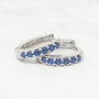 Sapphire September Birthstone Huggie Silver Earrings, thumbnail 1 of 3