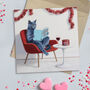 You Own Cat Reading 'Surviving Christmas With Idiots' Pack Of Twelve Greeting Cards, thumbnail 1 of 4