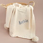 Personalised Ivory Knitted Baby Blanket With Pom Poms, thumbnail 1 of 7