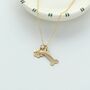 Dog Paw And Bone Charm Necklace, thumbnail 1 of 2