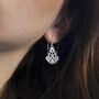 Sterling Silver Dangly Indian Hearts Earrings, thumbnail 1 of 8
