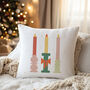 Festive Candle Trio Christmas Cushion, thumbnail 1 of 5