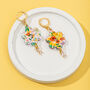 18 K Gold Plated Huggie Earrings With Iridescent Summer Flowers And A Hanging Gemstone, thumbnail 3 of 9