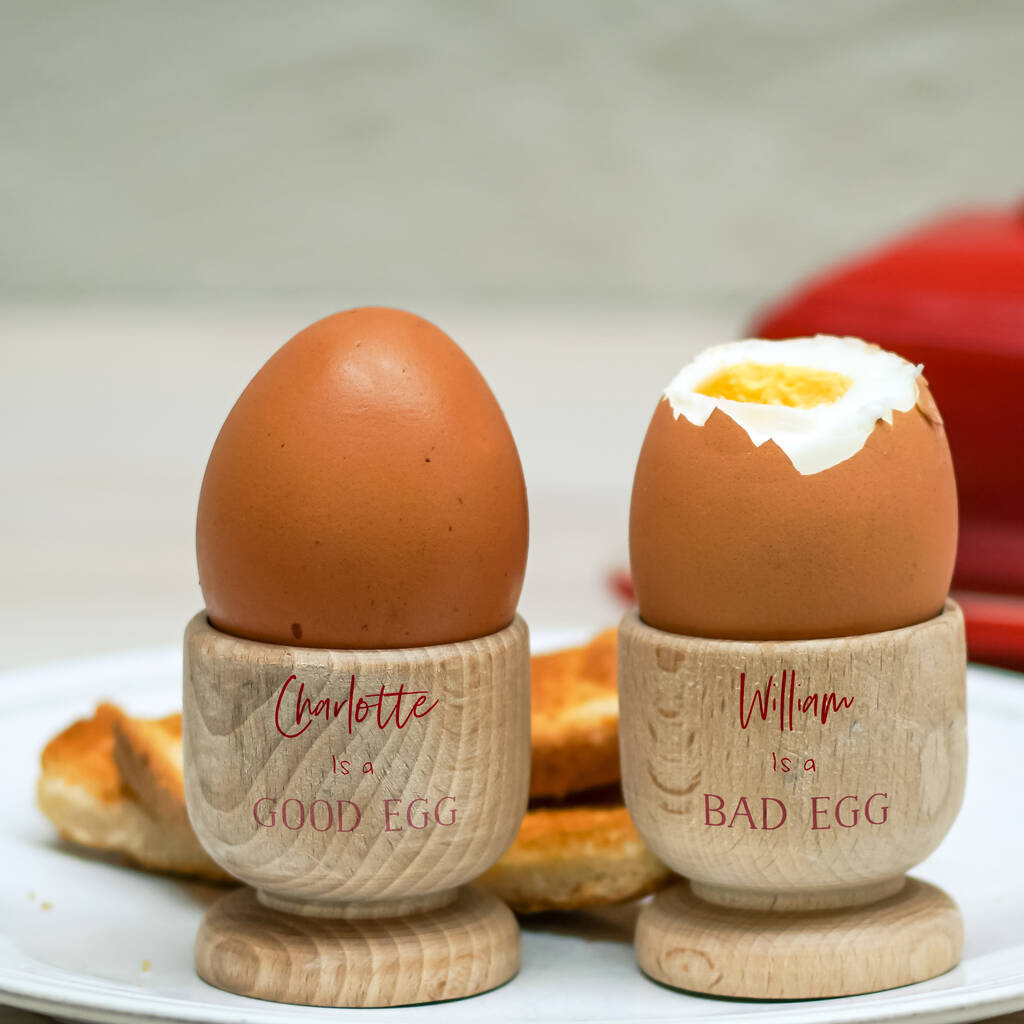 Personalised Good/Bad Egg Wooden Egg Cups, 1 of 2