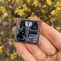 Cat And Books Enamel Pin With Shaker Moving Glitter And Stars, thumbnail 1 of 4