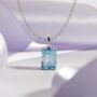 Blue Topaz Emerald Cut Pendant Necklace In Sterling Silver And Gold, thumbnail 1 of 11