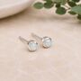 Tiny Sterling Silver Round White Opal Stud Earrings, thumbnail 1 of 7