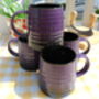 Set Of Four Reactive Glaze Brûlée Mugs In Black And Deep Purple, thumbnail 7 of 8