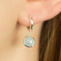 Sterling Silver Huggie Hoop Earrings With Round Seafoam Chalcedony Charms, thumbnail 2 of 8