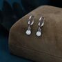 Sterling Silver White Opal Dot Huggie Hoop Earrings, thumbnail 1 of 9