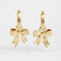 Gold Forget Me Not Bow Huggie Earrings, thumbnail 3 of 9
