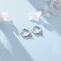 Sterling Silver Extra Tiny Ruby Pink Cz Huggie Hoop Earrings, thumbnail 1 of 9