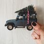 Muddy Land Rover Defender With Christmas Tree, thumbnail 1 of 2