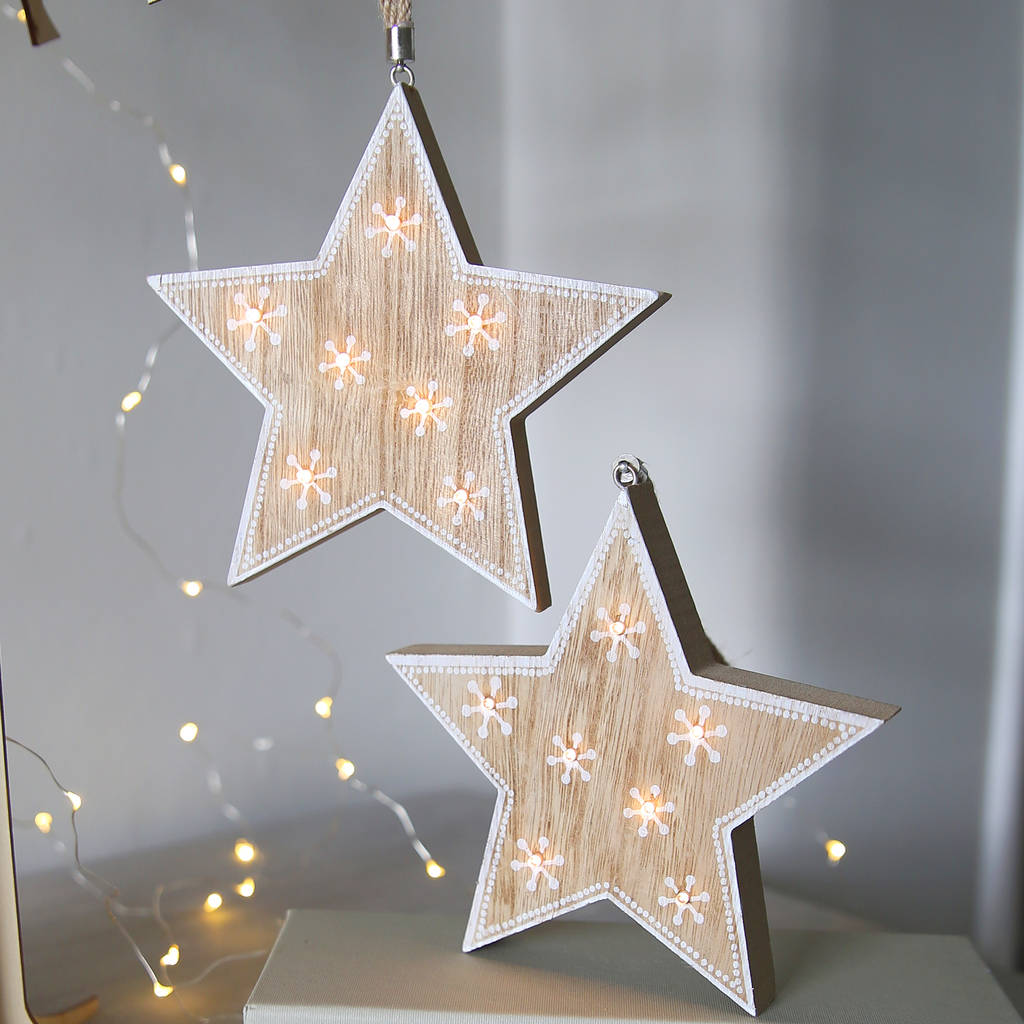 wooden star light hanging decoration by red lilly | notonthehighstreet.com