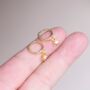 Gold Starburst Charm Hoop Earrings, thumbnail 1 of 7