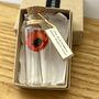 Tiny Gerbera Daisy In A Bottle With Personalised Tag, thumbnail 6 of 11