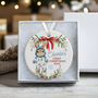 Personalised Baby's First Christmas Ceramic Bauble In Pink, Blue Or Red, thumbnail 1 of 8