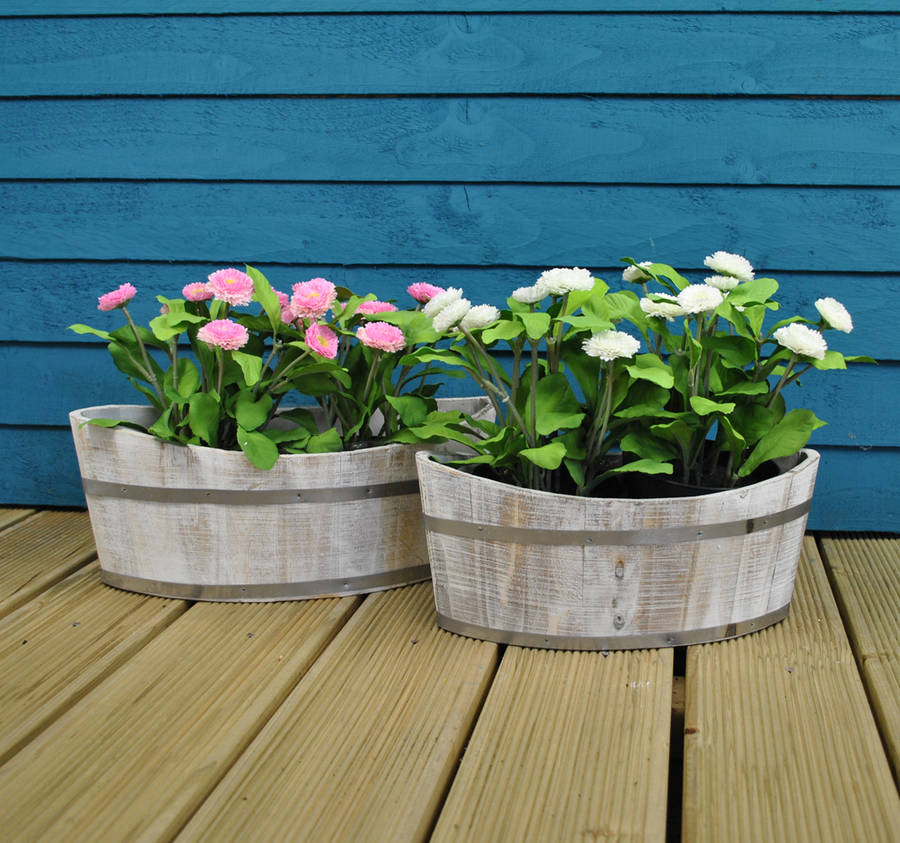 white washed boat shaped planters by garden selections