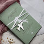 Sage Green Passport Invitation With Acrylic Plane Charms For Destination Wedding, thumbnail 1 of 10