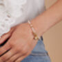 Amare White Cultured Freshwater Pearl Bracelet With Gold Hematite Beads And A Gold Heart Charm, thumbnail 1 of 3