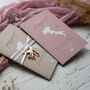 Dusky Pink Passport Invitation With Acrylic Plane Charms For Destination Wedding, thumbnail 3 of 9