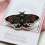 Black Enamel Butterfly Brooch With Red Floral Detail, thumbnail 1 of 5
