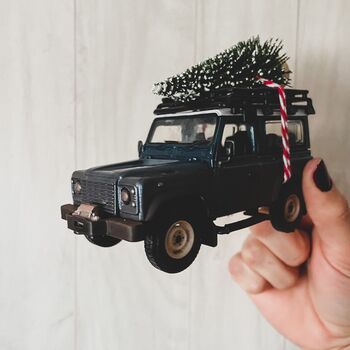 Muddy Land Rover Defender With Christmas Tree, 2 of 2
