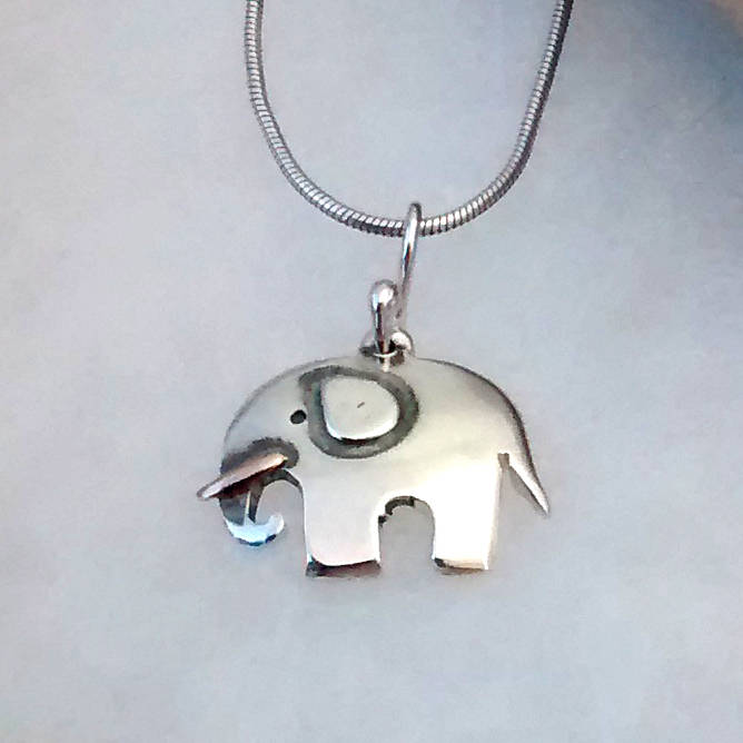 elephant pendant in recycled silver with golden tusk by dale virginia ...