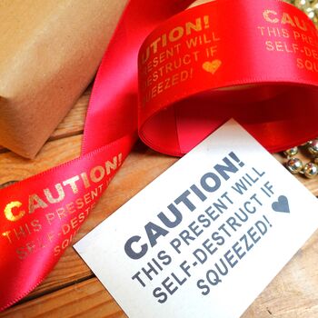 'This Present Will Self Destruct If Squeezed!' Ribbon, 3 of 3