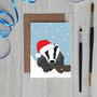Christmas Badger Card Wearing Santa Hat, thumbnail 1 of 2