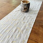Holly Leaves Christmas Table Runner, Cream And Gold Muslin, thumbnail 1 of 8