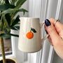 Ceramic Milk Jug With Embossed Orange Motif, thumbnail 1 of 7