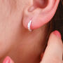 Sterling Silver Petite Textured Huggie Hoop Earrings, thumbnail 1 of 6