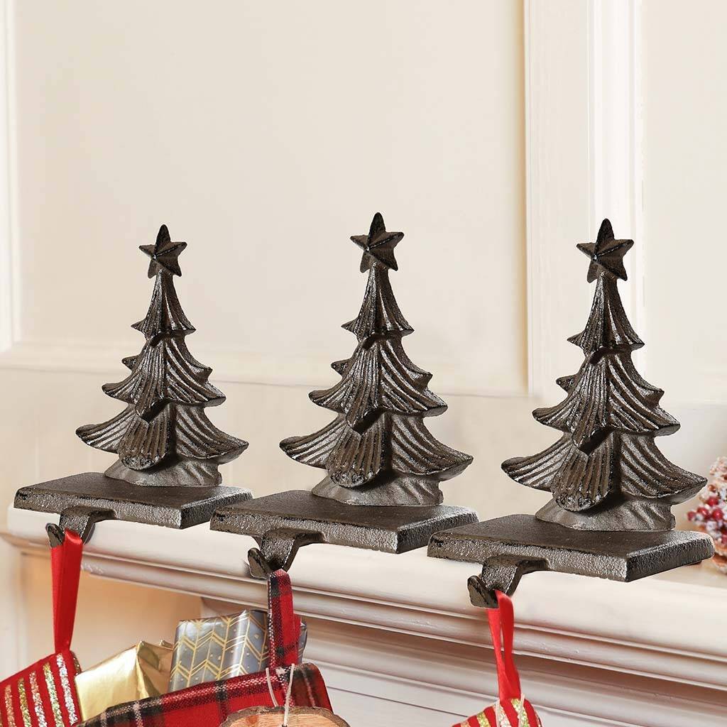 set of three christmas stocking hangers by dibor  notonthehighstreet.com