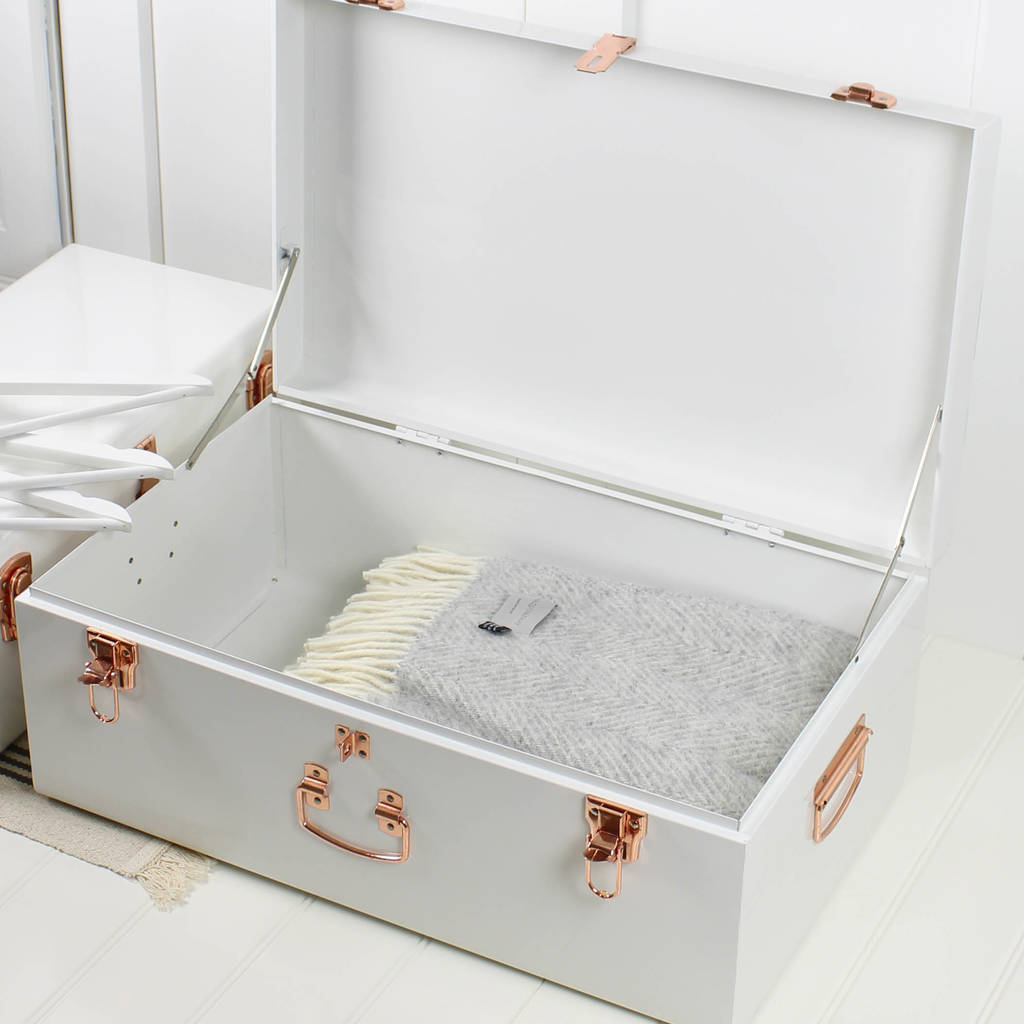 two white and copper storage trunks by marquis & dawe