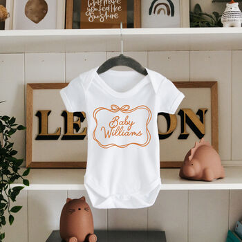 Personalised New Baby Gift Surname Bodysuit With Bow Frame, 2 of 6