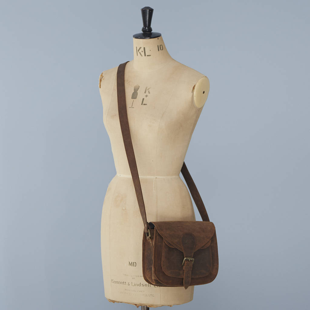personalised curved brown leather saddle bag by paper high