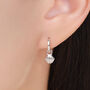 Sterling Silver Shell Huggie Hoops, thumbnail 1 of 11