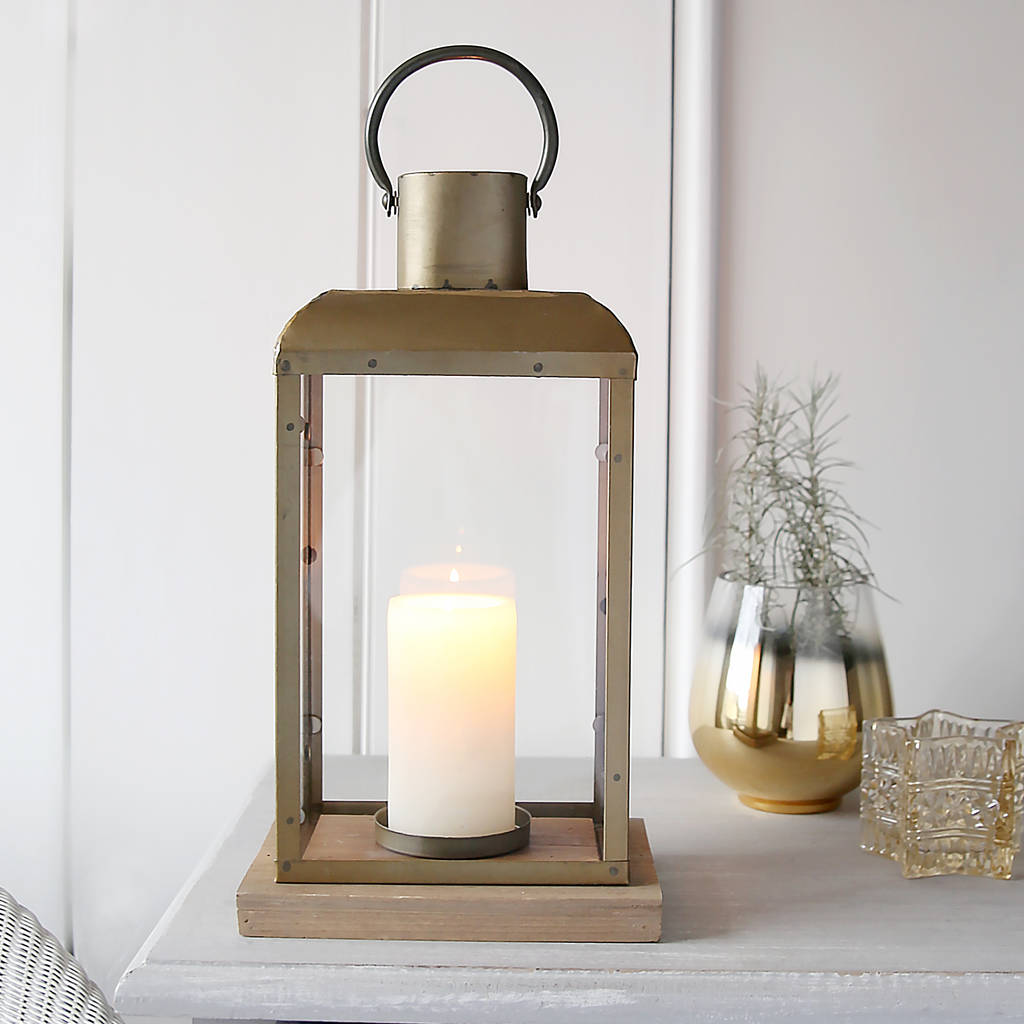 bronze lantern with wooden base by red lilly | notonthehighstreet.com
