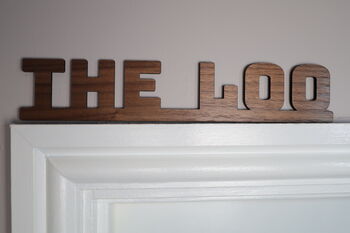 The Loo Sign: Walnut Wood Door Topper With Adhesive Dots, 3 of 7