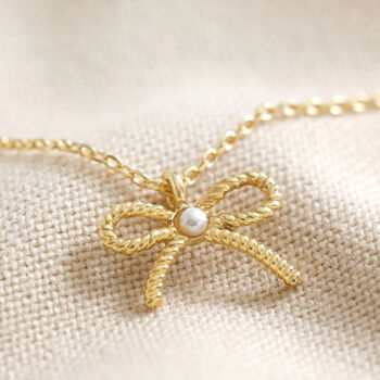 Tiny Pearl Bow Pendant Necklace, 3 of 9