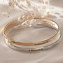 Blessed Slim Brass Bangle In Gold Or Silver Finish, thumbnail 1 of 12
