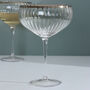 G Decor Set Of Four Ribbed Champagne And Gin Glasses With Silver Rim, thumbnail 4 of 5