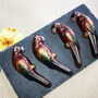 Four Hand Painted Belgian Dark Chocolate Ara Macaws, thumbnail 2 of 5