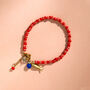 Red Candy Stripe Bead And Fish Charm Bracelet, thumbnail 1 of 5
