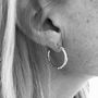 Deia Small Silver Kiss Hoop Earrings, thumbnail 3 of 4
