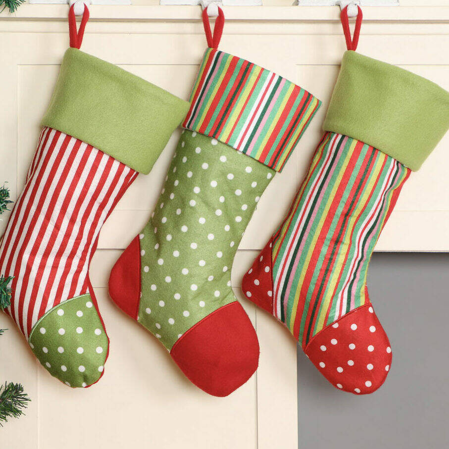 set of three christmas stocking hangers by dibor | notonthehighstreet.com