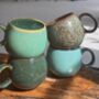 Set Of Four Reactive Glaze Mugs In Tones Of The Rainforest, thumbnail 8 of 11